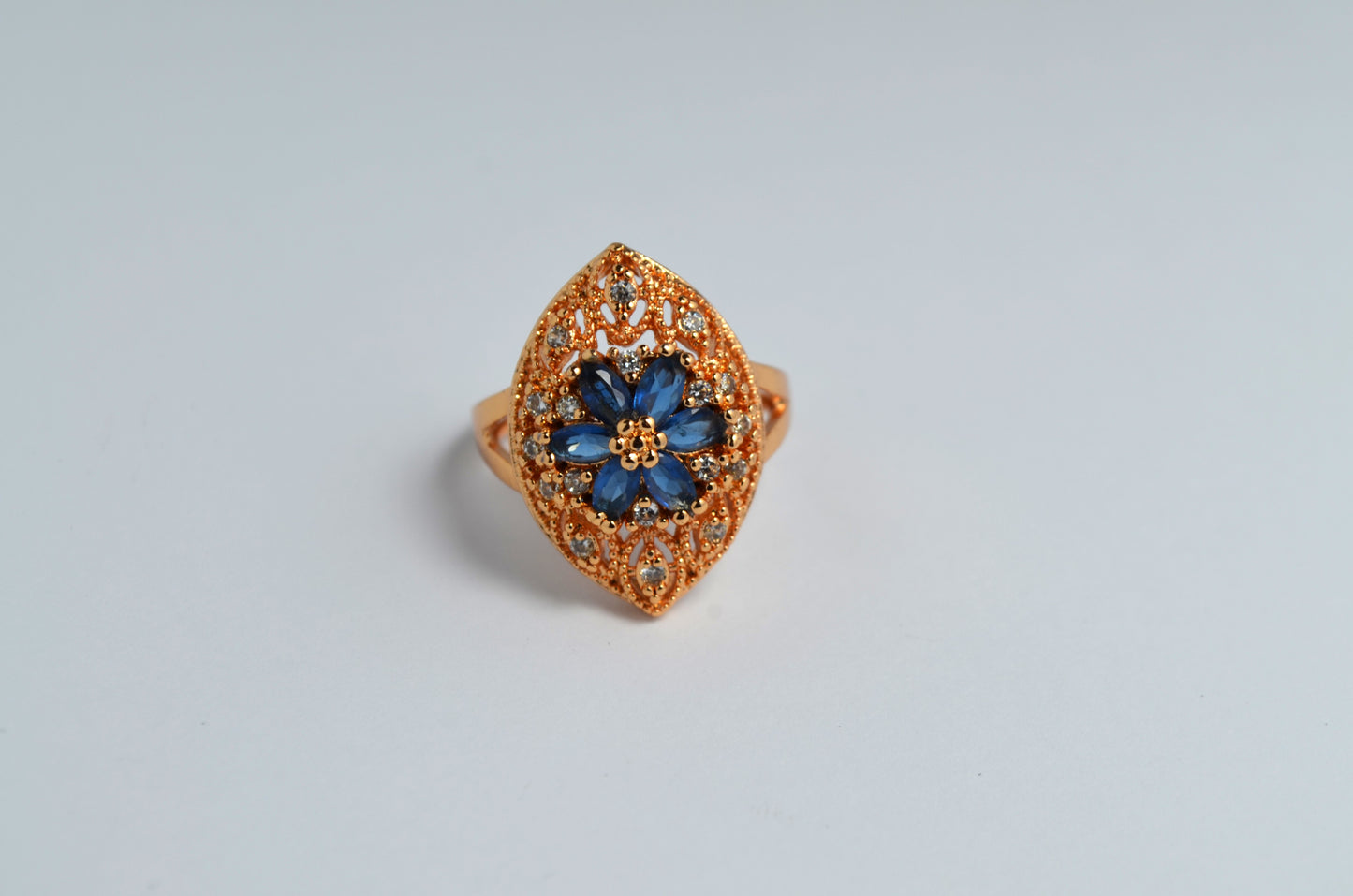 Elegant Leaf-Shaped Gold-Plated Ring with Blue Sapphire and Zircon Petals